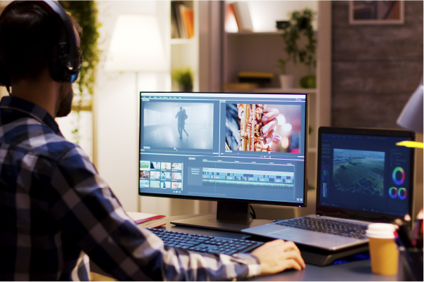 Photo of a man creating content on a computer