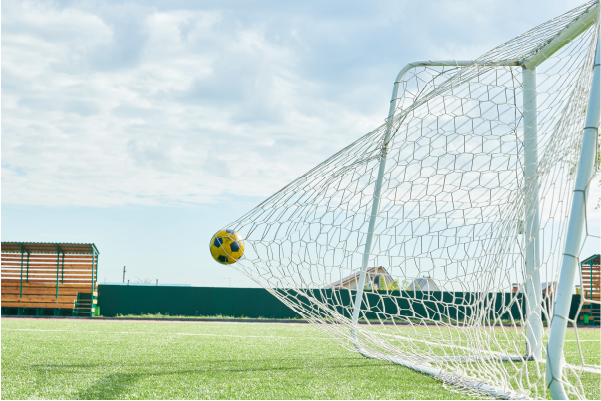 Photo of soccer ball going into goal