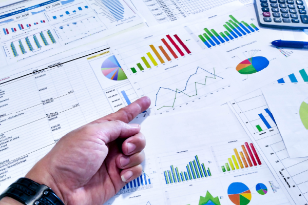 Photo of documents with graphs and charts