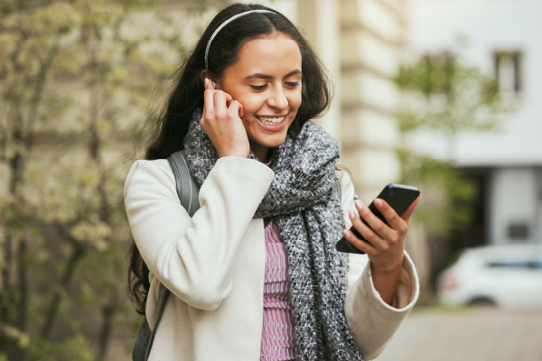 Photo of woman looking at smartphone